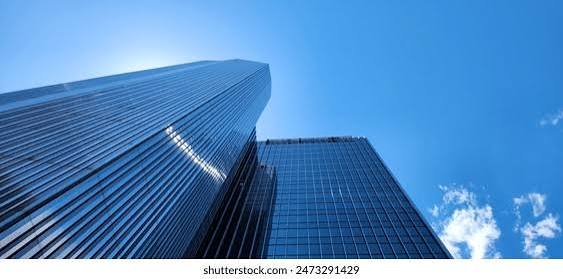 AustinNNN — modern glass towers rising against a clear blue sky