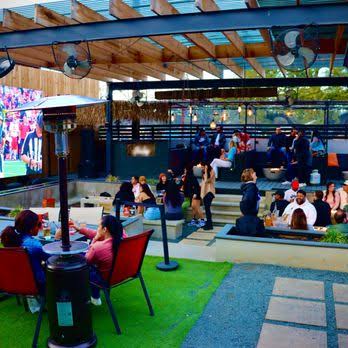 Pavilion bar patio with seating and screens